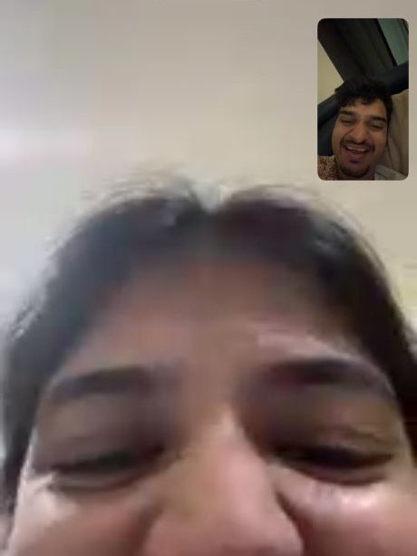 Unnati laughing on a video call with Urvish